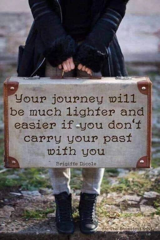 Person holding suitcase with inspiring quote.