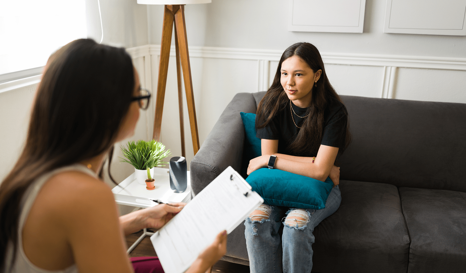 Young woman in therapy session with counselor