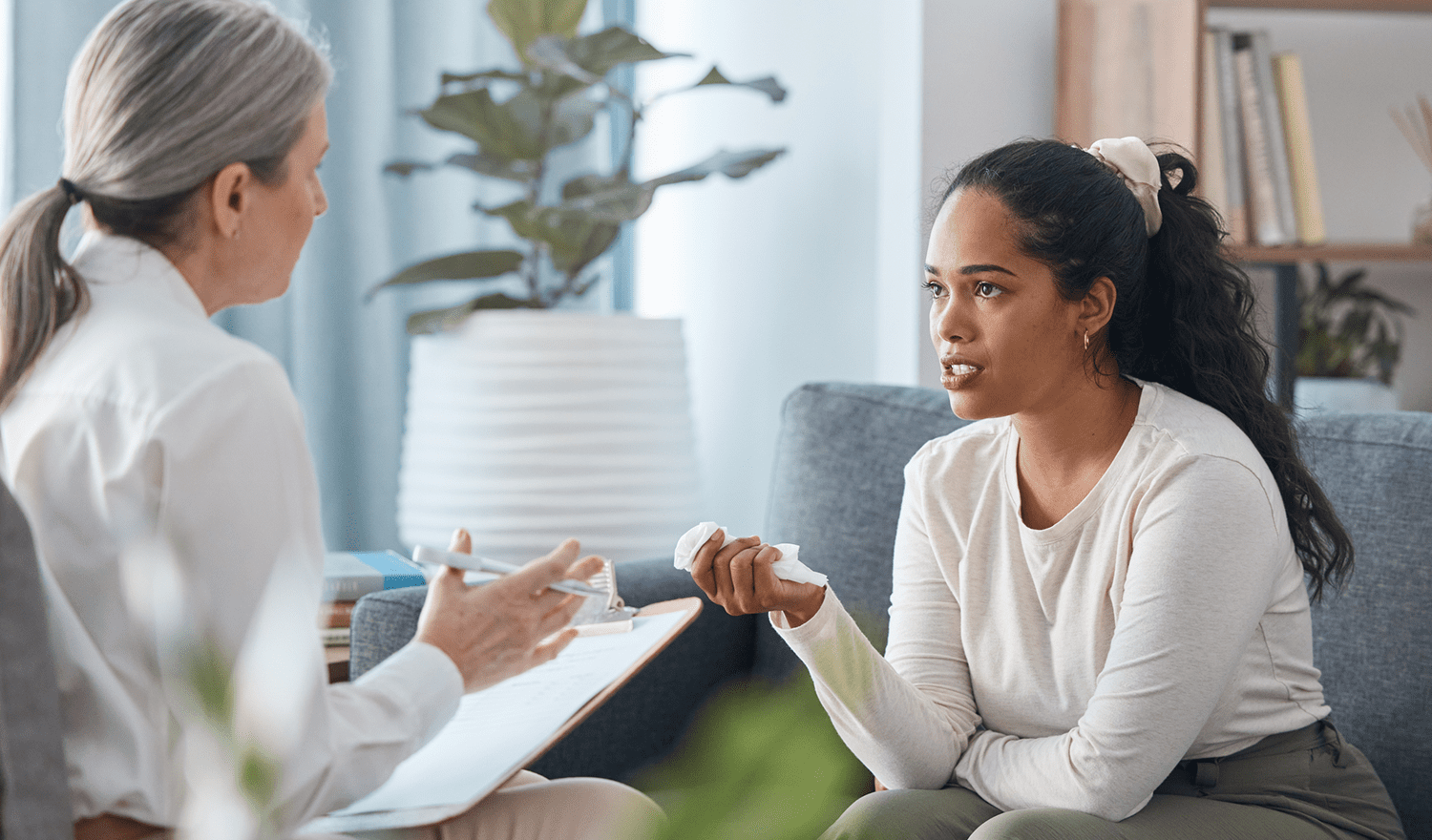 Woman discussing concerns with therapist in office