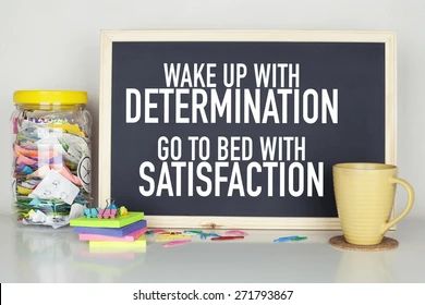 Motivational quote on a board with mug.