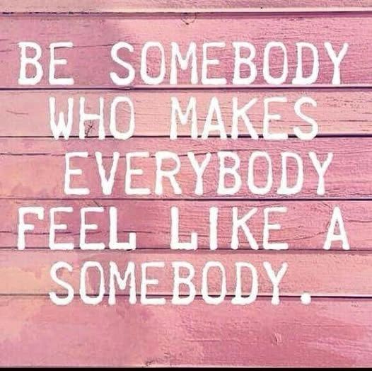 Inspirational quote on pink wooden background.
