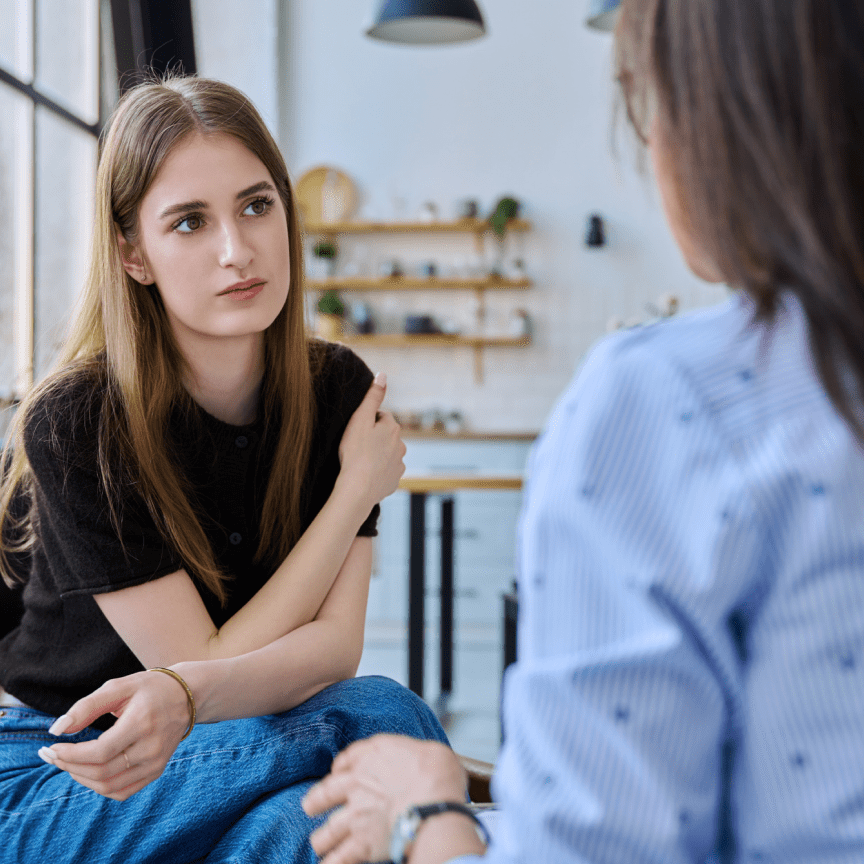 Young woman attentively listening to another person